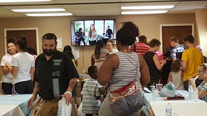 A church family gathering around a shared meal